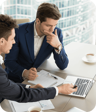 Business professionals discussing project strategies and software solutions.