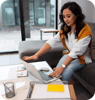 Young woman working on laptop in modern office setting, technology, programming, remote work.